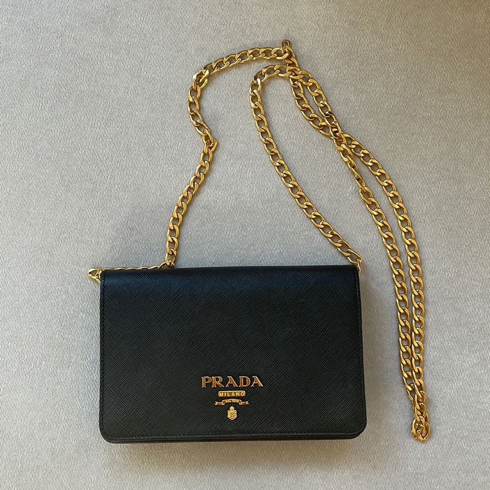 Prada Saffiano black leather crossbody mini bag with gold hardware. Gently used.